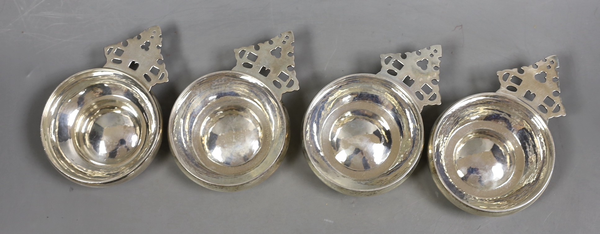 A matched set of four silver Tessier porringers, with pierced handles, London, 1946(1) and 1990(3), 11.6cm, 16.2oz.